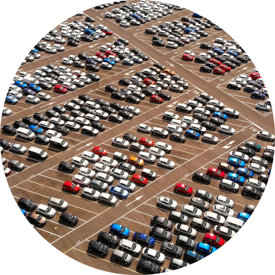 hundreds of cars on a huge parking lot